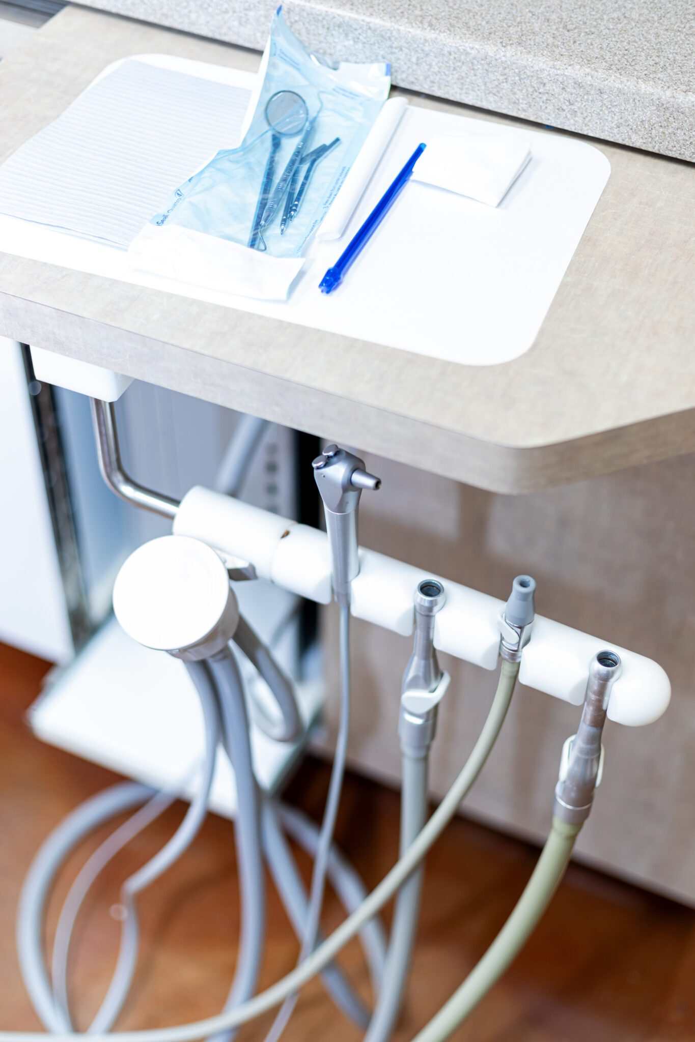 Clean dental handpieces lined up on a treatment tray at Oak Hills Dentistry