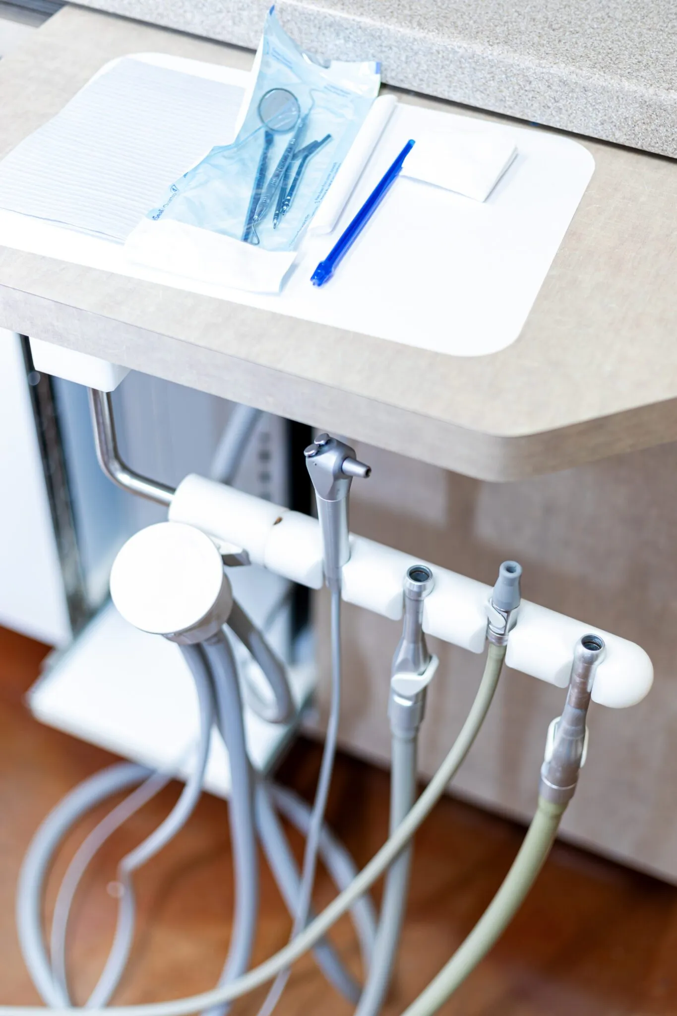 Clean dental handpieces lined up on a treatment tray at Oak Hills Dentistry