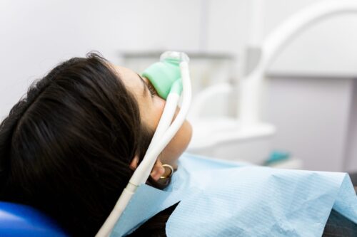 anxious patient undergoing sedation during a dental procedure