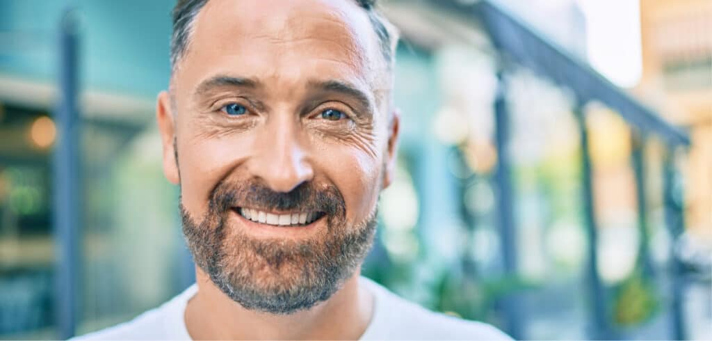 Adult male smiling after dental bridgework in Spring, TX