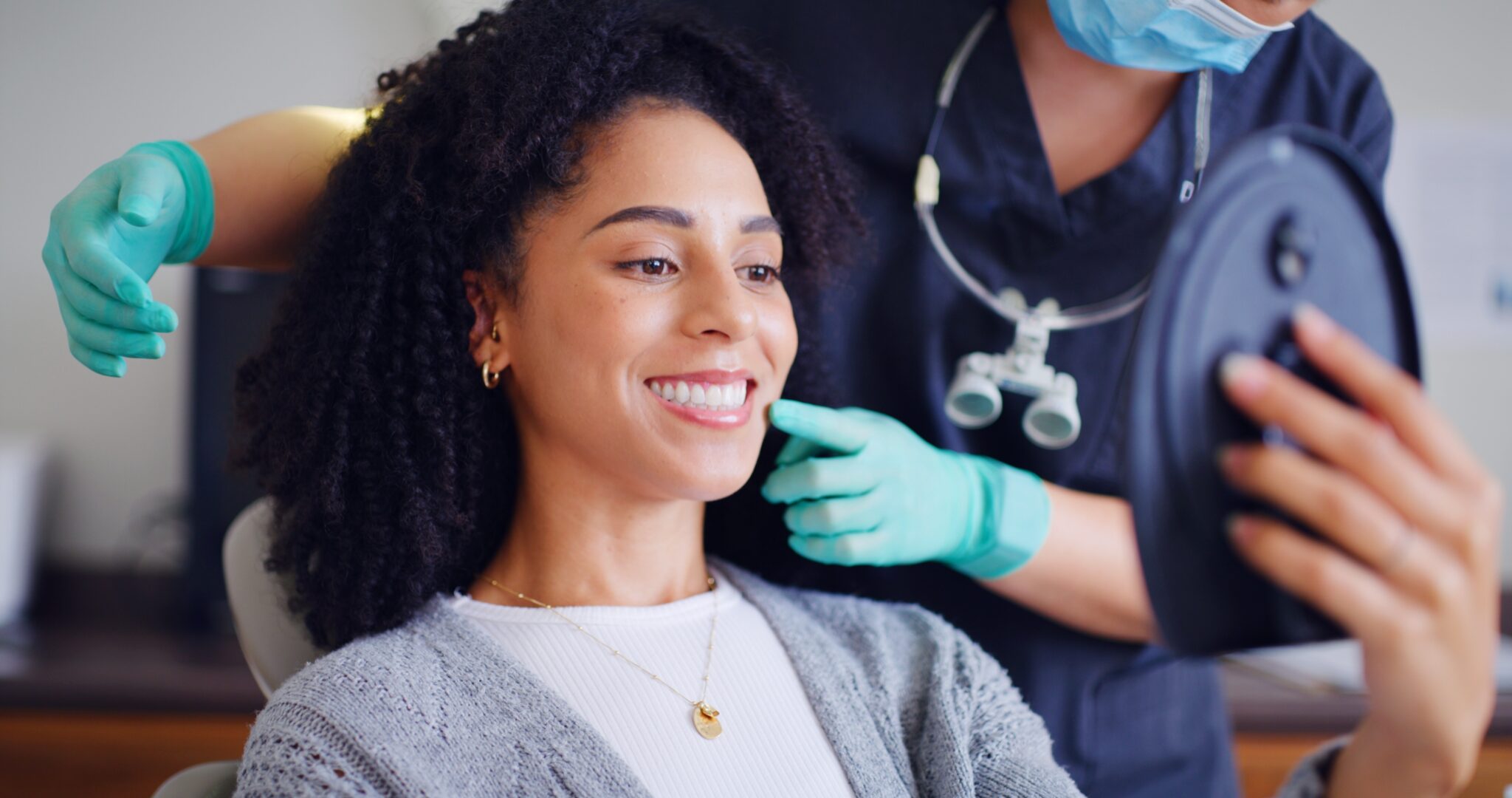 young woman in a dental chair, routine cleaning and consultation