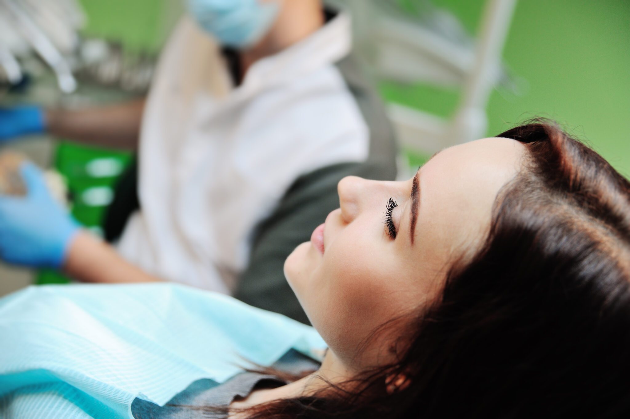 closeup of a relaxed young woman in a dental chair